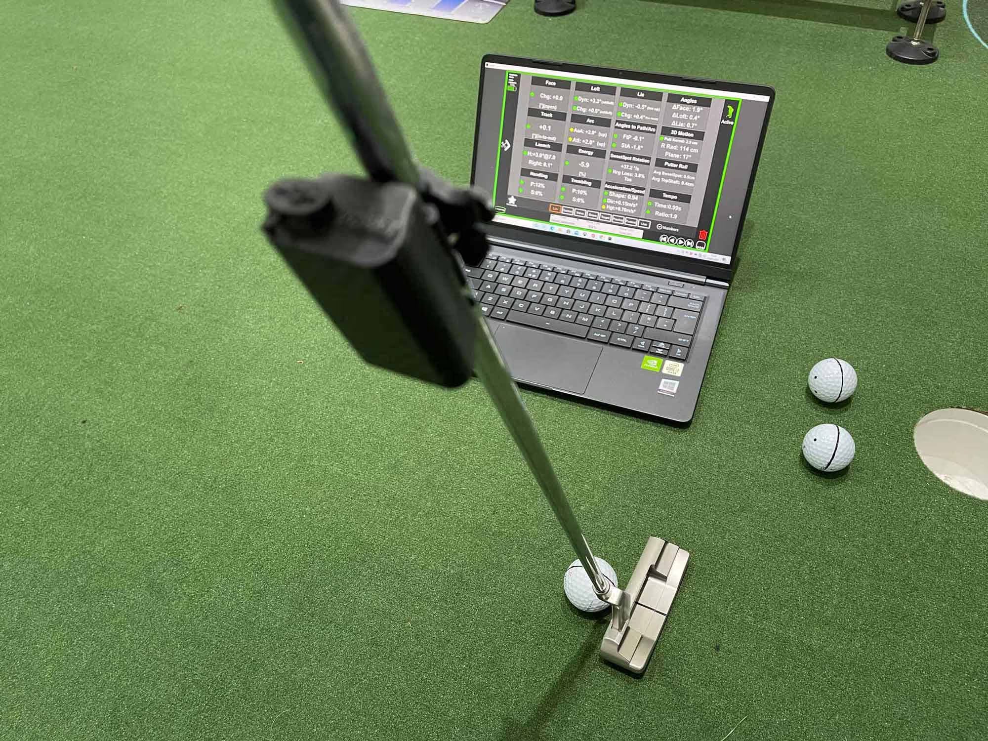 Capto device in use with a laptop showing various readouts to the player