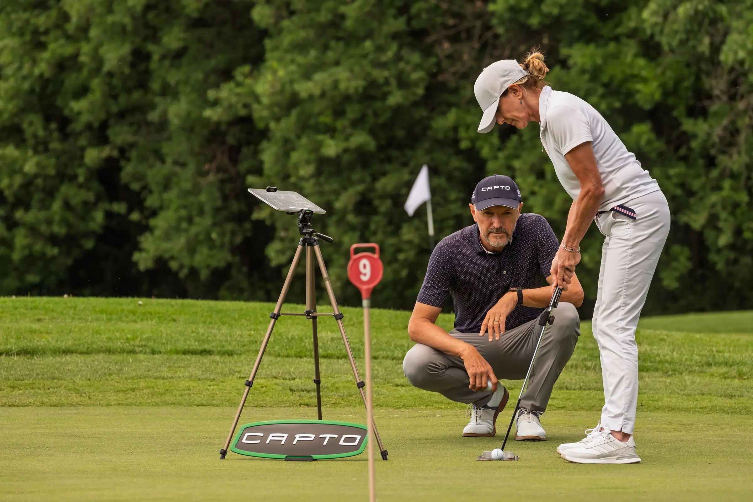 Capto Golf putting analysis system used by a coach and golfer on the green to measure stroke performance, putter movement and putting accuracy.